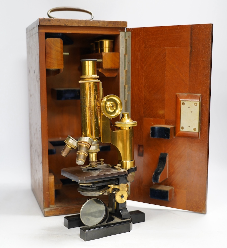 A Carl Zeiss microscope, detailed by Baker 244 High Holborn, London, in a fitted mahogany cased with alternative lenses, etc., case 38cm. Condition - fair to good